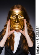 Woman with mask in hypocrisy concept. Стоковое фото, агентство Ingram Publishing / Фотобанк Лори