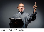 Young priest isolated on the white. Стоковое фото, агентство Ingram Publishing / Фотобанк Лори