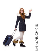 Woman with suitcase preparing for winter vacation. Стоковое фото, агентство Ingram Publishing / Фотобанк Лори