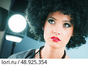 Young attractive girl with afro curly haircut. Стоковое фото, агентство Ingram Publishing / Фотобанк Лори