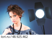 Young attractive girl with in the studio shooting. Стоковое фото, агентство Ingram Publishing / Фотобанк Лори
