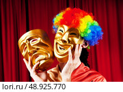 Actor with maks in a funny theater concept. Стоковое фото, агентство Ingram Publishing / Фотобанк Лори