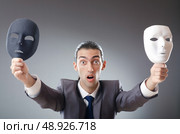 Industrial espionate concept with masked businessman. Стоковое фото, агентство Ingram Publishing / Фотобанк Лори
