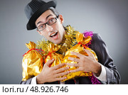 Businessman with sacks of presents. Стоковое фото, агентство Ingram Publishing / Фотобанк Лори