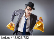 Businessman with sacks of presents. Стоковое фото, агентство Ingram Publishing / Фотобанк Лори
