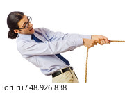 Businessman in tug of war concept. Стоковое фото, агентство Ingram Publishing / Фотобанк Лори