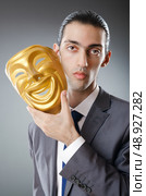 Industrial espionate concept with masked businessman. Стоковое фото, агентство Ingram Publishing / Фотобанк Лори
