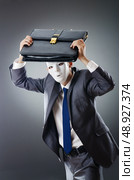 Industrial espionate concept with masked businessman. Стоковое фото, агентство Ingram Publishing / Фотобанк Лори