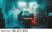 A musician sits in a recording studio, working on music in front of a computer with audio equipment around him. Стоковое AI-изображение, AI-художник Данила Большаков / Фотобанк Лори