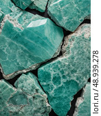 The stunning blue-green amazonite mineral stone reveals intricate textures and vibrant hues, inviting exploration and admiration of its natural formation and beauty Generative AI. Стоковое AI-изображение, AI-художник Юлия Петровская / Фотобанк Лори