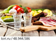 glasses of vodka with various traditional  snack. Стоковое фото, агентство Ingram Publishing / Фотобанк Лори