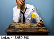 Upset man has spent all his money. Стоковое фото, агентство Ingram Publishing / Фотобанк Лори