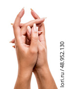 Beautiful woman posing hands over white background. Стоковое фото, агентство Ingram Publishing / Фотобанк Лори