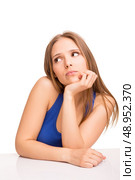Cute blonde girl thinking over white background. Стоковое фото, агентство Ingram Publishing / Фотобанк Лори
