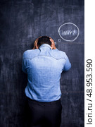 Man at blackboard asking why. Стоковое фото, агентство Ingram Publishing / Фотобанк Лори