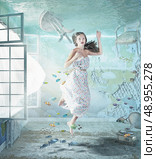 the young beautiful girl underwater in the flooded interior. creative concept. Стоковое фото, агентство Ingram Publishing / Фотобанк Лори