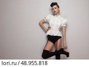Sexy trendy model posing in vintage shirt, black lingerie, high heels. Стоковое фото, агентство Ingram Publishing / Фотобанк Лори
