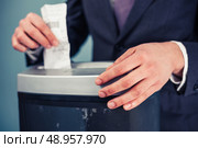 A Businessman is shredding important documents. Стоковое фото, агентство Ingram Publishing / Фотобанк Лори