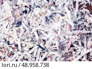 Paper cut into tiny pieces by cross shredder. Стоковое фото, агентство Ingram Publishing / Фотобанк Лори