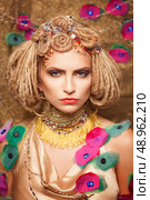 young woman with fashion makeup on brown background. Стоковое фото, агентство Ingram Publishing / Фотобанк Лори