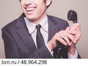 Happy young businessman is on the phone. Стоковое фото, агентство Ingram Publishing / Фотобанк Лори