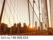 Brooklyn Bridge sunset with Manhattan skyline of New York City USA. Стоковое фото, агентство Ingram Publishing / Фотобанк Лори