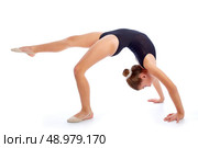 Kid girl rhythmic gymnastics exercises on white background. Стоковое фото, агентство Ingram Publishing / Фотобанк Лори