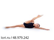 Kid girl rhythmic gymnastics exercises on white background. Стоковое фото, агентство Ingram Publishing / Фотобанк Лори