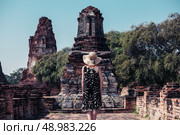 A young woman is exploring the ancient ruins of a buddhist temple city. Стоковое фото, агентство Ingram Publishing / Фотобанк Лори