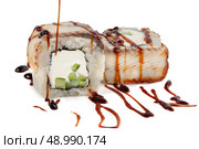 Sushi closeup isolated on white background. Sushi roll with graham rice, Philadelphia cheese and celery topped with soy sauce. Стоковое фото, фотограф Лазаренко Светлана / Фотобанк Лори