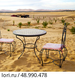 table and seat in  desert sahara morocco    africa yellow sand. Стоковое фото, агентство Ingram Publishing / Фотобанк Лори