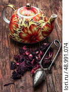 the teapot in the background of elite sorts of tea.the image is tinted in vintage style. Стоковое фото, агентство Ingram Publishing / Фотобанк Лори