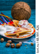 baked toast smeared ice cream in raspberry jam. freshly baked waffle pecan coconut dessert with appendices ice cream.Selective focus. Стоковое фото, агентство Ingram Publishing / Фотобанк Лори