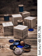 spool sewing thread and buttons in vintage style. Стоковое фото, агентство Ingram Publishing / Фотобанк Лори