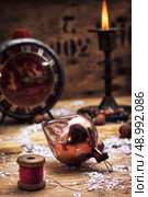 set foto burning Christmas candle in  brass candlesticks. Стоковое фото, агентство Ingram Publishing / Фотобанк Лори