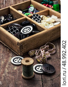 tools seamstresses on wooden background.the image is tinted in vintage style. Стоковое фото, агентство Ingram Publishing / Фотобанк Лори