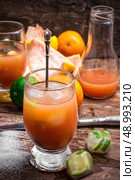fresh tropical fruit juices. glass with drink of freshly squeezed tropical fruit with pulp.Selective focus.Photo tinted. Стоковое фото, агентство Ingram Publishing / Фотобанк Лори