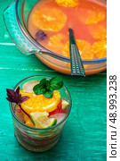 fresh tropical fruit juices. glass with drink of freshly squeezed tropical fruit with pulp.Selective focus.Photo tinted. Стоковое фото, агентство Ingram Publishing / Фотобанк Лори