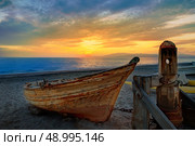 Almeria Cabo de Gata beached boats in San Miguel beach of Spain. Стоковое фото, агентство Ingram Publishing / Фотобанк Лори