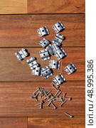 Ipe decking deck wood installation screws clips and fasteners. Стоковое фото, агентство Ingram Publishing / Фотобанк Лори