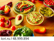 Mexican food mixed guacamole nachos chili sauce dipping cheddar cheese lemon pico de gallo. Стоковое фото, агентство Ingram Publishing / Фотобанк Лори