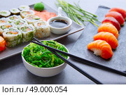 Sushi Maki and Niguiri California roll with seaweed chuka salad soy sauce and wasabi. Стоковое фото, агентство Ingram Publishing / Фотобанк Лори