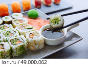 Sushi Maki and Niguiri with soy sauce and wasabi with California Roll. Стоковое фото, агентство Ingram Publishing / Фотобанк Лори