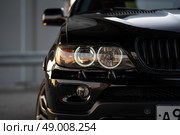 KRASNOYARSK, RUSSIA - May 23, 2025: Black BMW X5 E53. Редакционное фото, фотограф Плотников Дмитрий / Фотобанк Лори