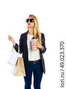 Blond shopaholic woman with bags and take away coffee cup. Стоковое фото, агентство Ingram Publishing / Фотобанк Лори