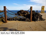 yellow lifeguard chair cabin  in spain  lanzarote  rock stone sky cloud beach  water  musk pond  coastline and summer 
. Стоковое фото, агентство Ingram Publishing / Фотобанк Лори