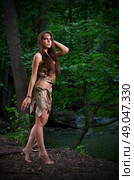 Young barefoot girl in forest. Стоковое фото, агентство Ingram Publishing / Фотобанк Лори