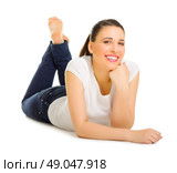 Young woman laying on the floor isolated. Стоковое фото, агентство Ingram Publishing / Фотобанк Лори