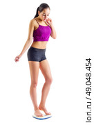 Sporty girl with scales isolated. Стоковое фото, агентство Ingram Publishing / Фотобанк Лори