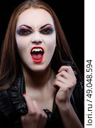 Young beautiful vampire woman isolated. Стоковое фото, агентство Ingram Publishing / Фотобанк Лори